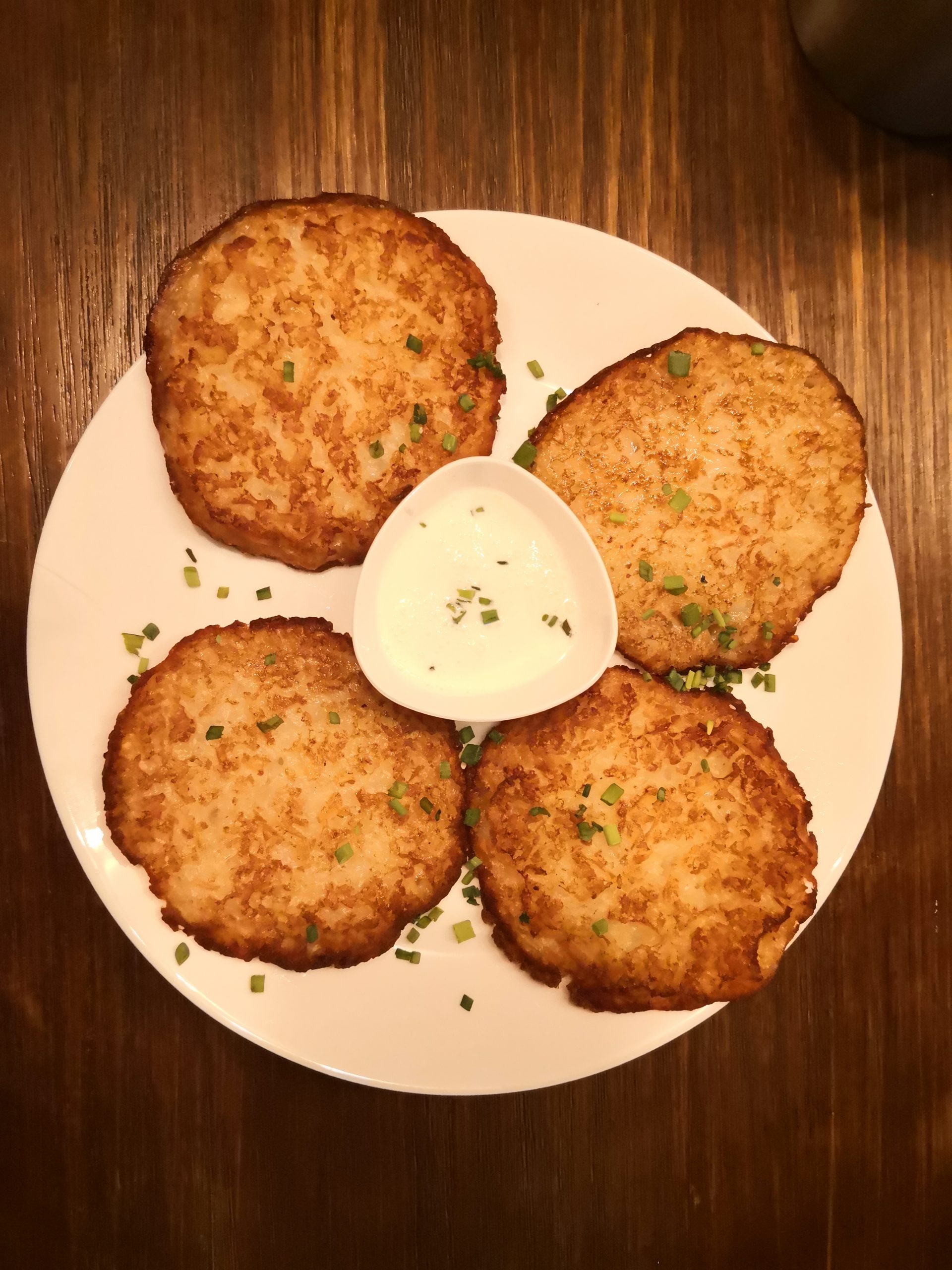 Rosti with spring onions sprinkled on top